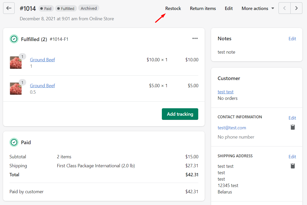 Shopify order page showing fulfilled items, payment, and restock option