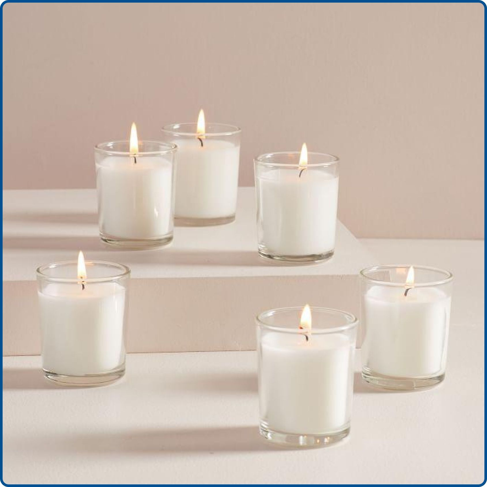 Small votive candles in molds for table décor